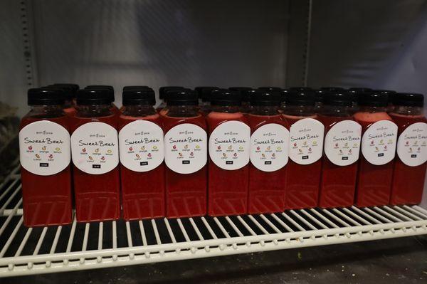 Bottles of red Sweet Beet located at Rum Runners Bakery