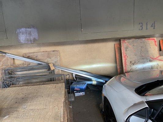 Construction equipment piled up next to parking spot without notice