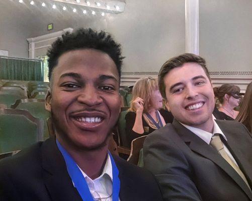 Hoston Fannings and Jacob Poston of Hoston & Poston Insurance smile at Aflac ceremony. The duo provides employee benefits across Georgia.