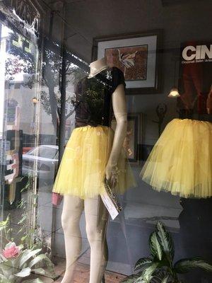 The colorful studio window display, featuring memorabilia from the Paris Opéra Ballet.