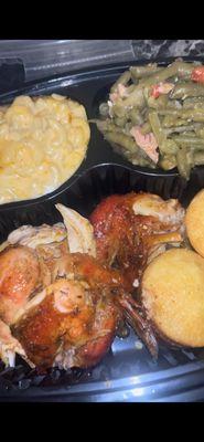 Cornish hen , baked Mac & cheese , green beans with potatoes & smoked turkey meat , honey corn bread muffin