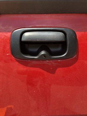 Back up camera installed in 2007 Chevy tailgate handle.