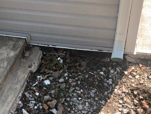 hole  on the side of garage left after removing drywell container