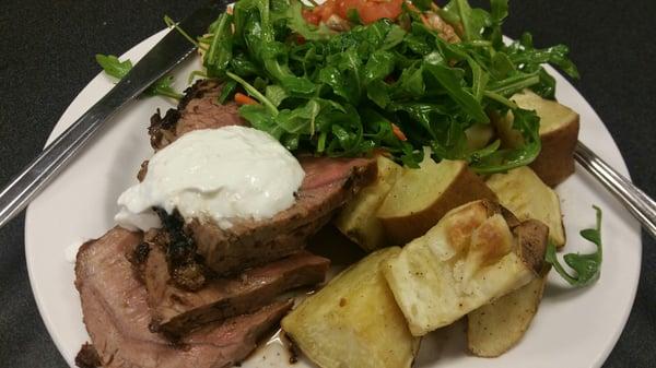 Garlic herb roasted beef with horse radish sauce, arugula salad, and Sweet potato bake