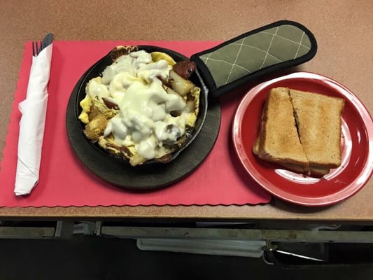 Breakfast scrambler skillet.  Two scrambled eggs, choice of meat, home fries and choice of cheese.