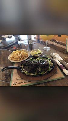 Churrasco with French fries and a side of black rice