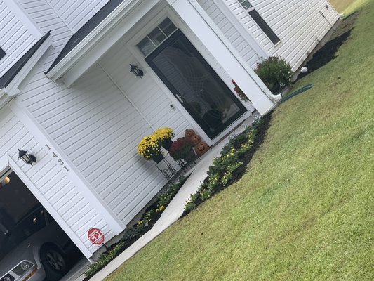 New flower bed installation with black mulch