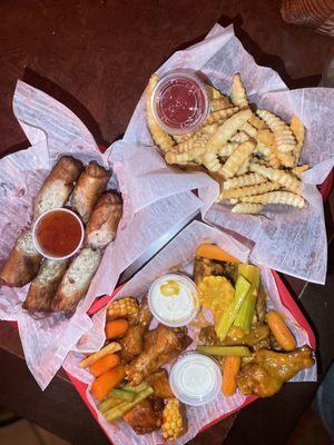 Chicken eggrolls, chicken wings, fries