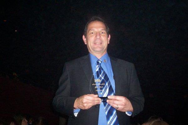 This is me holding my trophy for achieving  Circle of Excellence Gold Circle in 2009. $3.7 million in sales volume!