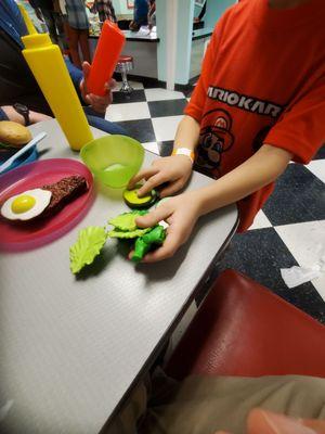 The chef made this so-called "Green Meal" but the waiter just dumped it on the table!