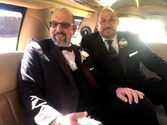 Groom and best-man in a limousine on the way to the wedding. Bow-tie and Windsor Knot tie tuxedos from Top Tier Tux.