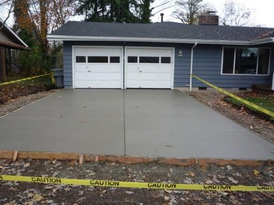 A basic concrete driveway... We bordered the driveway with pavers for a custom look