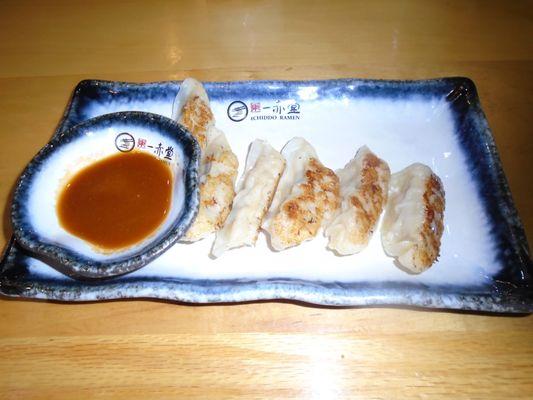 Gyoza with dipping sauce (pork dumplings).