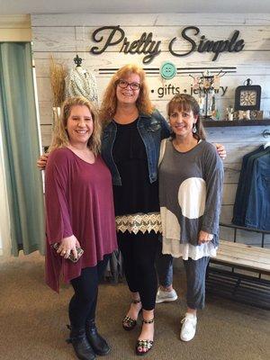 Awesome trendy clothing for beautiful curvacious ladies. I'm the customer in the middle, appreciating the two owners on either side of me.