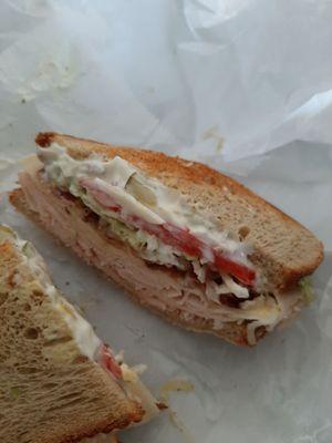 Turkey club with onion and pickle added.