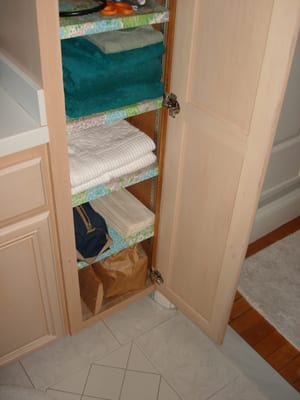 Attic Plank Stuffed in Bathrm Cabinet