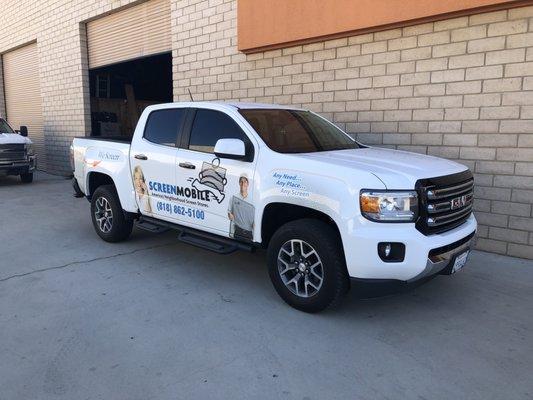 Getting our new truck wrapped.