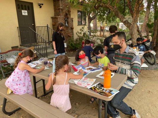 Miles teaching an art class at TCCC