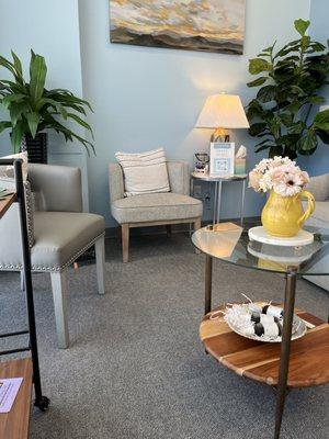 Waiting room showcases homey decor and products to review and purchase