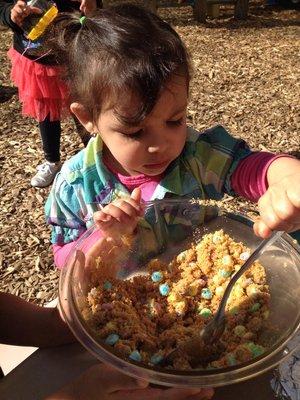 Making some concoction for the weekly preschool cooking project