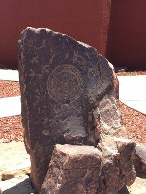 Rock with petroglyph outside restaurant