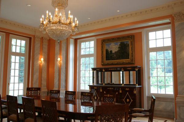 Dining room in custom built mansion by The CF Group LLC