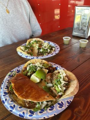 Quesa birria taco, carnitas taco and al pastor taco