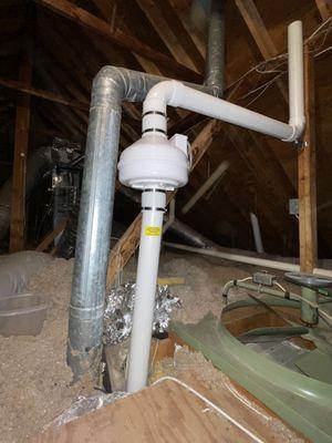 Vent pipe ends a few inches below the roof but should go THROUGH the roof and be sealed on the exterior to prevent rain leaks.