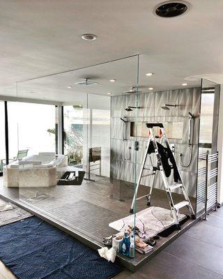 Huge Starphire glass stationary panel being installed in Laguna Beach