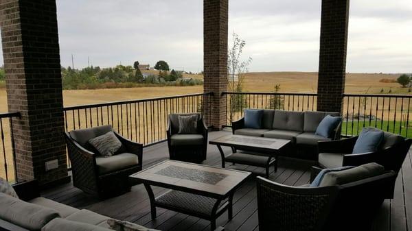 Metal deck railing and balusters for outdoor family area.