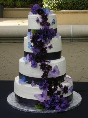 Butterflies abound among purple blossoms.