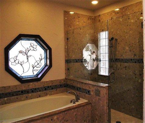 Gorgeous marble shower walls & tub surround with a frameless glass enclosure to finish off this elegant master bath renovation