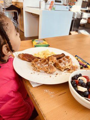 Children's waffles, scrambled egg and bacon! Also kids fruit!