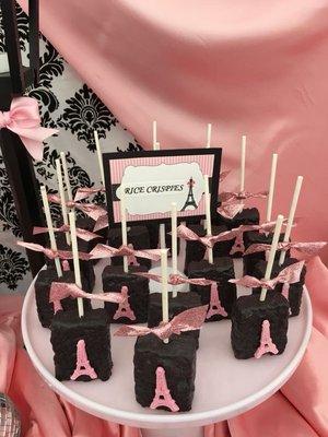 Cute custom made rice crispy treats dipped in chocolate with edible Eiffel tower decoration