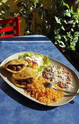 Gorditas, fried thick tortillas stuffed with meat, with rice & beans