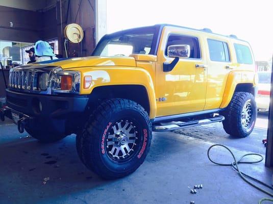 Hummer H3 on 17in Raceline Wheels wrapped on General Grabbers!