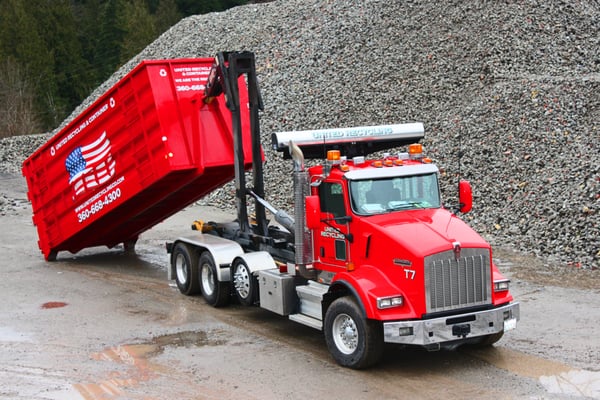 Hook truck and roll-off recycling container.