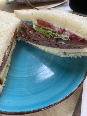 Roast beef with horseradish cheddar cheese and fixings.