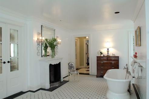 The Renovation of the Existing Master Bathroom featured the creation of a new Regency style fireplace flanked by new French d...