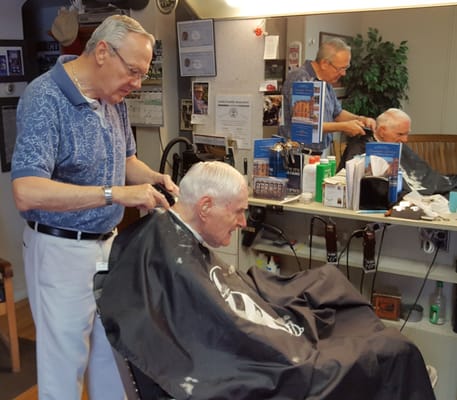 My Dad and Larry (the owner) having a great old chat while Larry cuts his hair