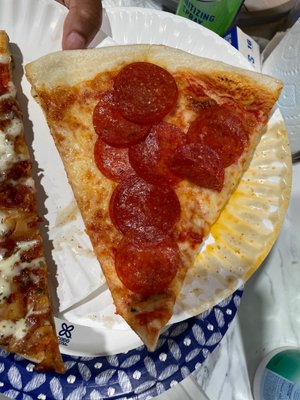 They threw a few slices of pepperoni on a piece of cheese pizza  ):