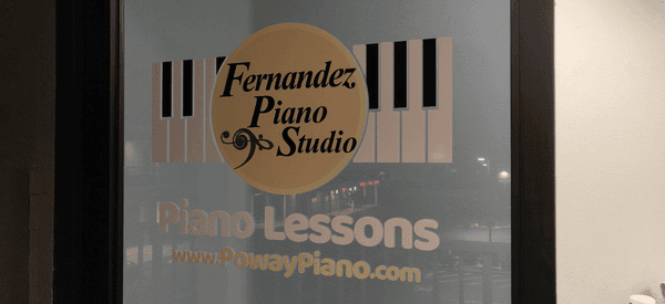 Fernandez Piano Studio Door | Business hours by appointment only.