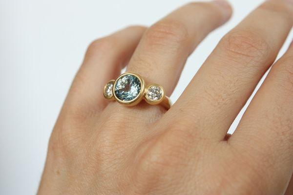 Custom aqua marine and diamond 3-stone engagement ring