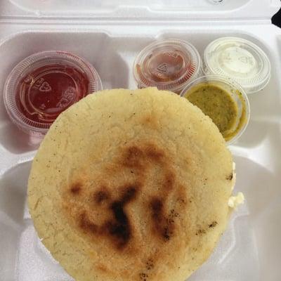 Cheese arepa with 3 different salsas: spicy, mild, creamy and jello on the side!