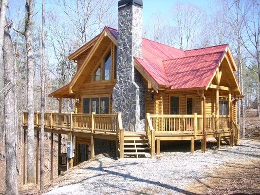 A beautiful Log Home, The "Justin" cabin. 1400 SF 2 bedroom, 2 bath. 
 Can be built to suit on your lot and the floor plan can be customized