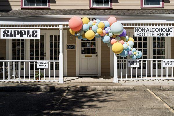 Exterior of the shop at the grand opening event.