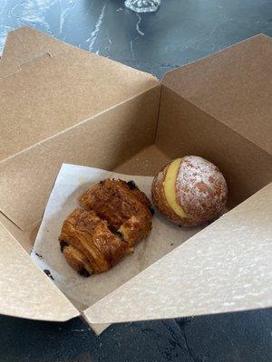 Chocolate croissant and a cream filled donut