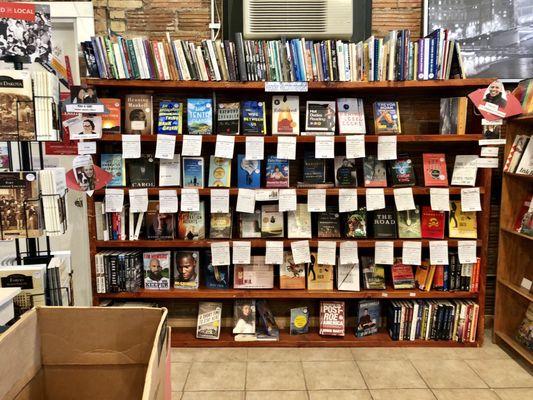 Books with the reader's insight and recommendations (that's what the white paper attached to the shelf is)