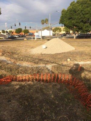 The gravel that was donated to fill drainage trenches.