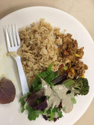 Vegan chicken, rice, salad, and broccoli.